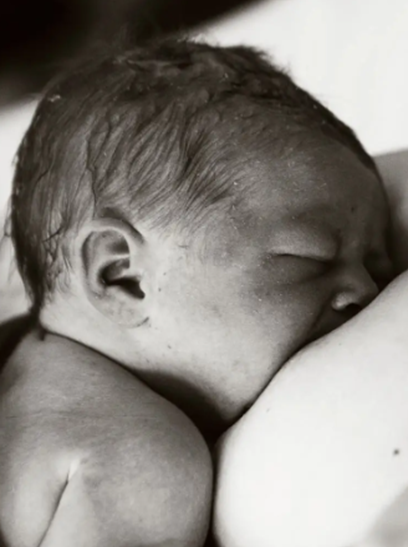 a newborn baby breastfeeding